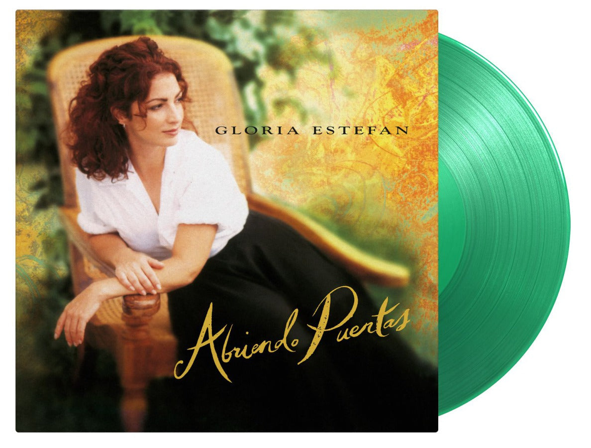 Gloria Estefan album cover and a green vinyl record beside it.