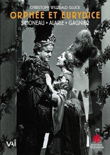 Opera performers in ornate costumes gaze at each other on DVD cover.
