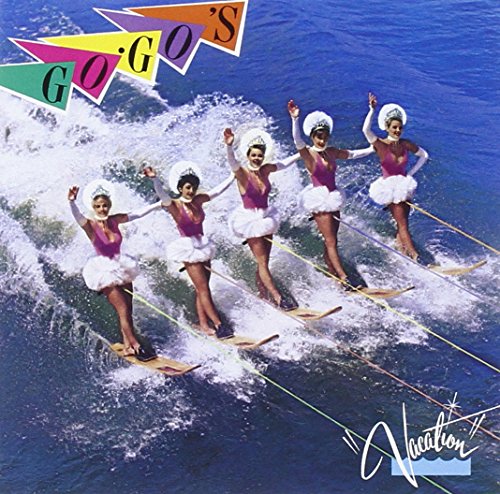The Go-Go's on surfboards, album cover for "Vacation" with colorful text.