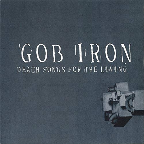 The alt text for the image is: "Gob Iron album cover with dark grey background and metal object."
