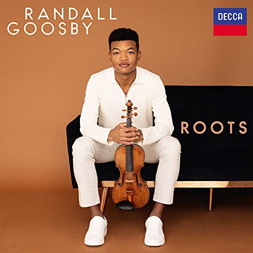 Randall Goosby sits holding a violin, album cover for “Roots.”