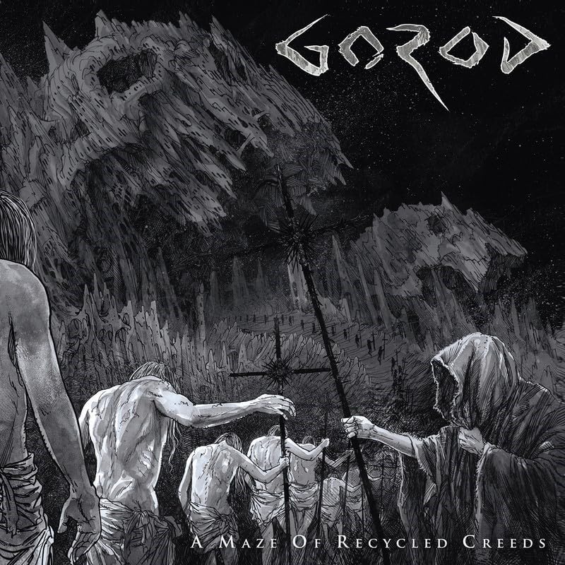 Black and white album cover depicting figures in a desolate, textured landscape.