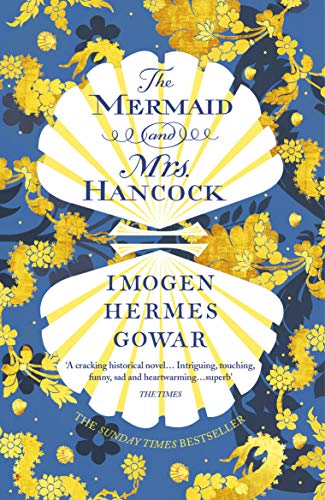 Book cover with a blue background, seashells, and gold floral details.