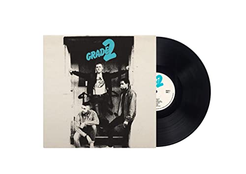 Vinyl record with cover art depicting three people on steps.