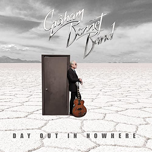 CD cover: Graham Bonnet Band, man with guitar by a doorway.