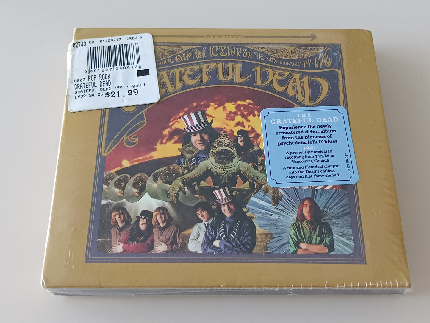 Grateful Dead album cover with band photo and textured background.