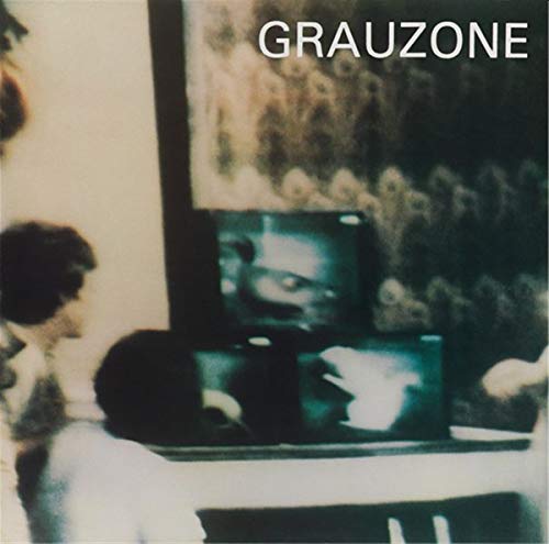 Grauzone album cover: blurred figures watching televisions in a room.
