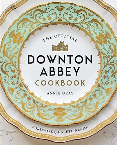 “The Official Downton Abbey Cookbook” cover with ornate gold detailing.