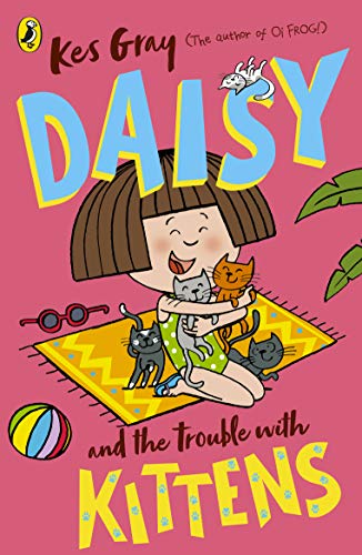 Book cover: girl with many kittens on a yellow rug.