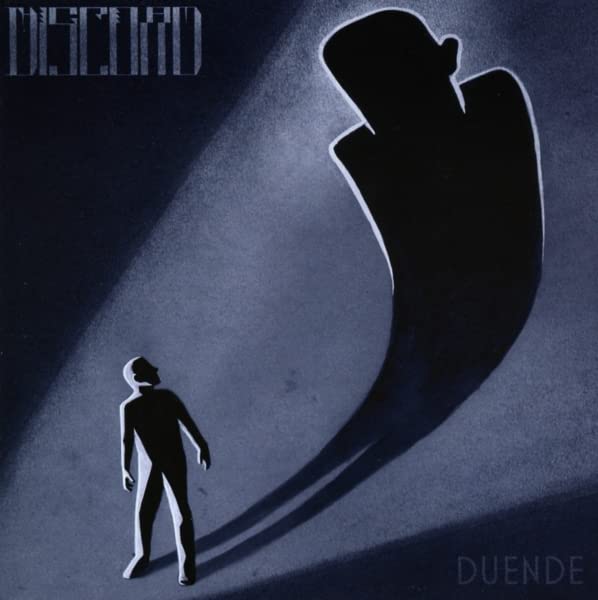 Silhouetted figure stands before a large, distorted shadow on a blue background.