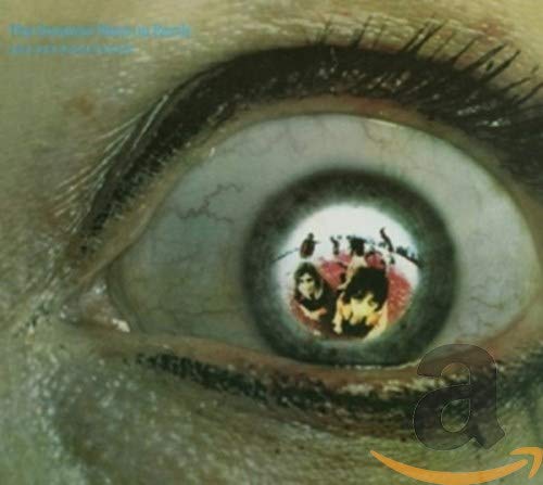 CD cover: close-up of an eye reflecting a circus scene.