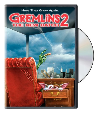 “Gremlins 2” DVD cover featuring a green hand with a cigar and city skyline.