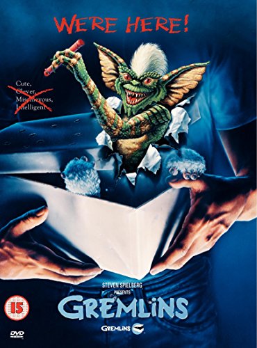 Gremlins DVD cover featuring a mischievous, grinning gremlin bursting through paper.