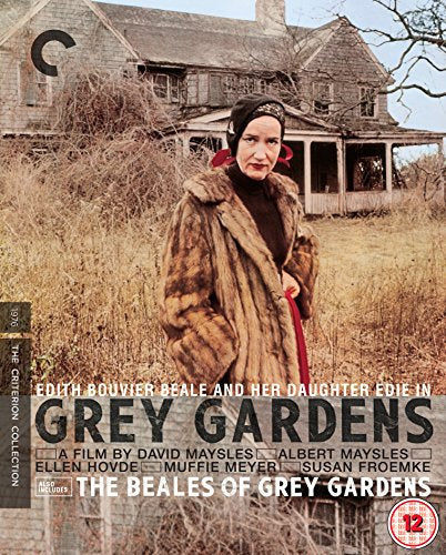 "Blu-ray cover featuring a woman in a fur coat standing in front of a dilapidated house."