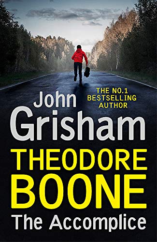 A boy in a red jacket runs down a road toward a forest.