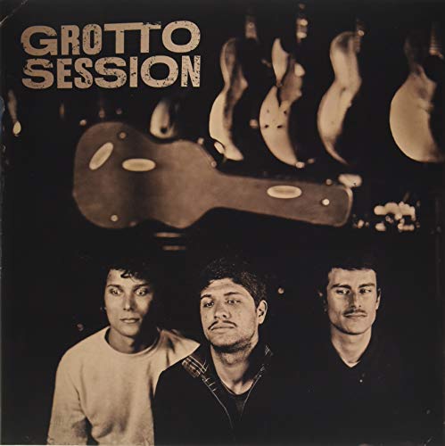 Vinyl record cover with three men’s faces and guitar silhouettes.