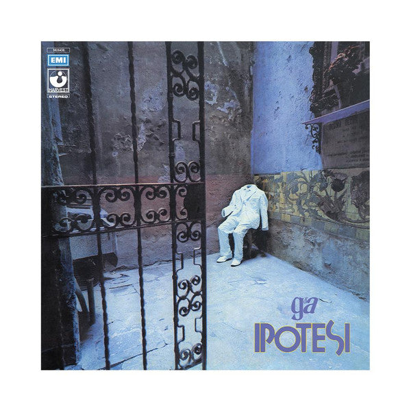 Album cover: headless figure in a suit sits before an ornate gate.