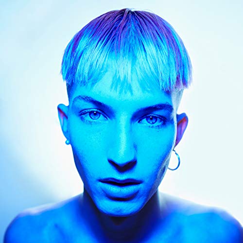 The image depicts a man with short hair, lit in blue, against a white background.