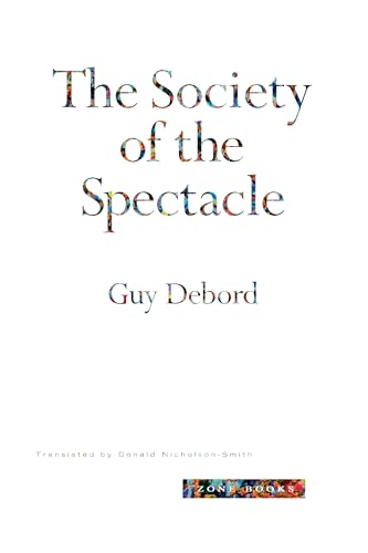 Book cover: "The Society of the Spectacle" by Guy Debord, white background.