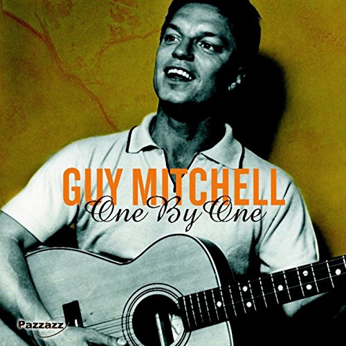 Guy Mitchell with acoustic guitar on album cover, orange text.