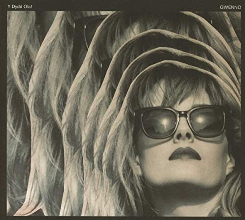 CD cover: woman with sunglasses, distorted and layered monochrome portrait.