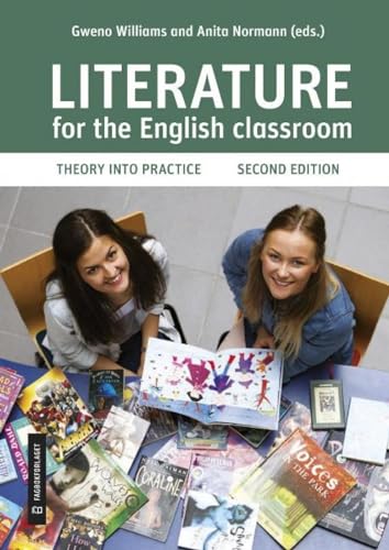 Two young women sitting at a table surrounded by various books and papers.