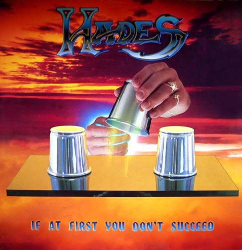 Hades album cover featuring a hand performing a cup and ball trick.