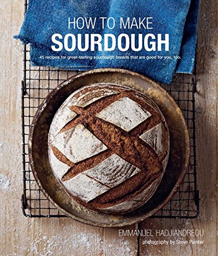 Cookbook cover featuring a round sourdough loaf on a cooling rack.