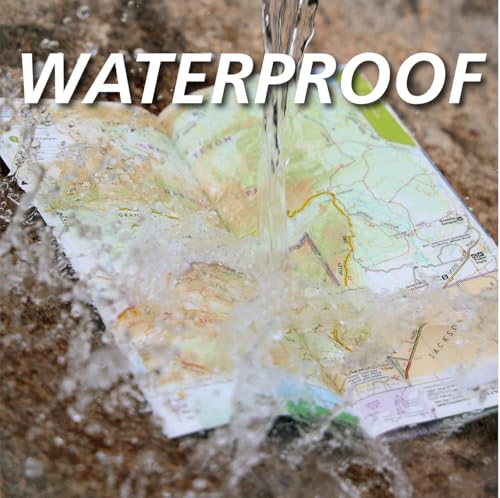 Waterproof map of Hadrian’s Wall Path with water splashing on it.