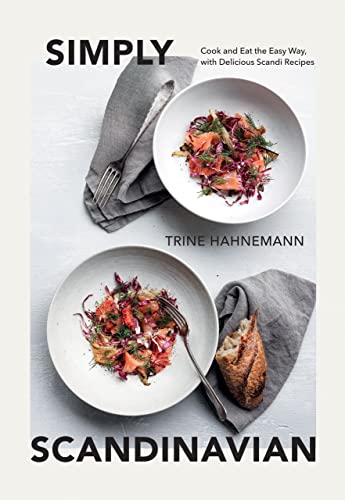 Cookbook cover with two bowls of salad, bread, and cutlery.
