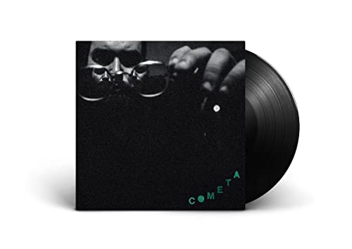 Vinyl record with album cover featuring a face obscured by glasses.