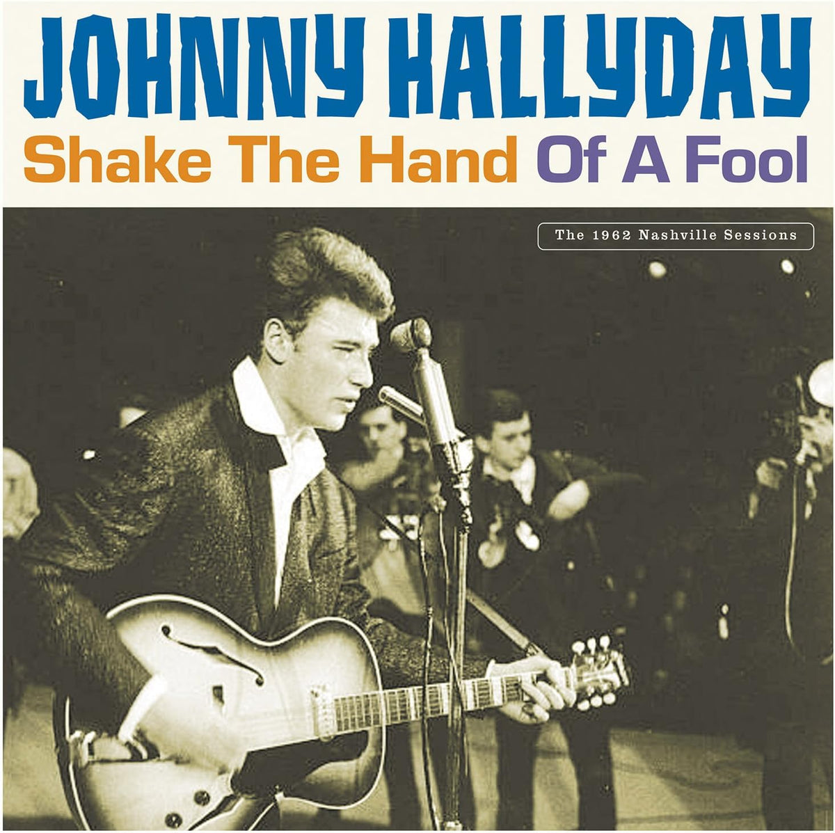 Johnny Hallyday album cover: a black and white photo of a singer with a guitar.