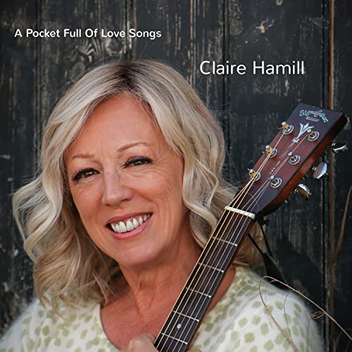 Claire Hamill album cover featuring a smiling woman with a guitar.