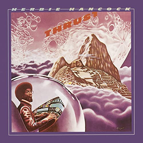 Herbie Hancock’s “Thrust” vinyl album cover: mountains, clouds, and a portrait.