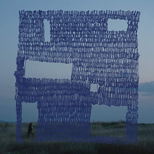 Blue, string-like building facade with a small figure in a field.