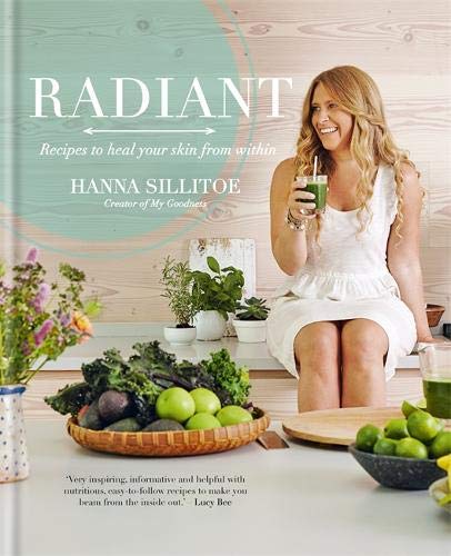"Book cover featuring a blonde woman in white holding a green drink, surrounded by fruits and vegetables."
