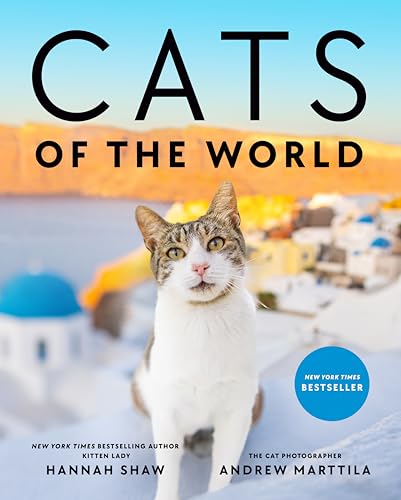 Book cover: "Cats of the World" featuring a tabby cat and Greek village.