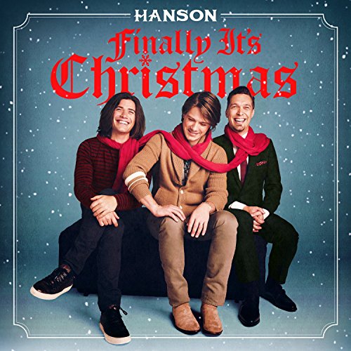 Three men wearing red scarves on a snowy-themed "Finally, It's Christmas" CD cover.