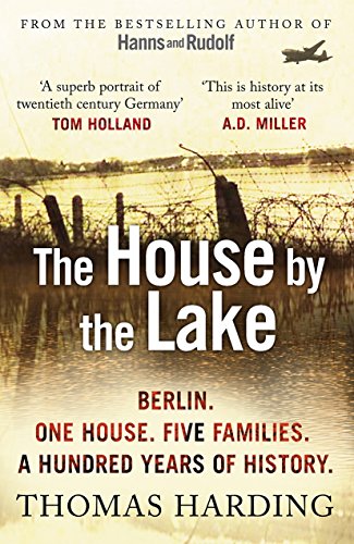 The image shows a book cover with a lake and barbed wire. The alt text is: "Book cover with lake, barbed wire, and white title text."