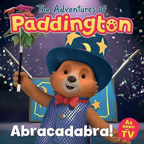 Paddington Bear in a magician’s hat holding a magic wand and flower.