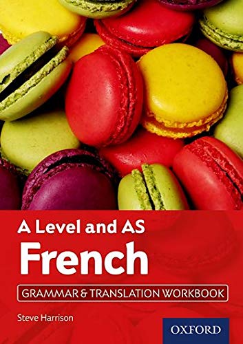 French language workbook with colorful macarons in the background.
