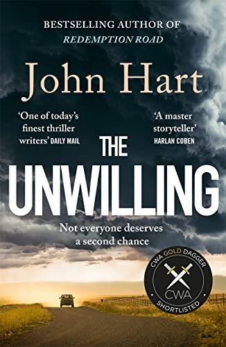 Book cover for "THE UNWILLING" by John Hart, with a stormy sky and road.