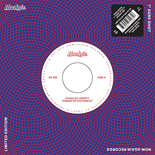 Vinyl record label with red and blue geometric pattern background and barcode sticker.