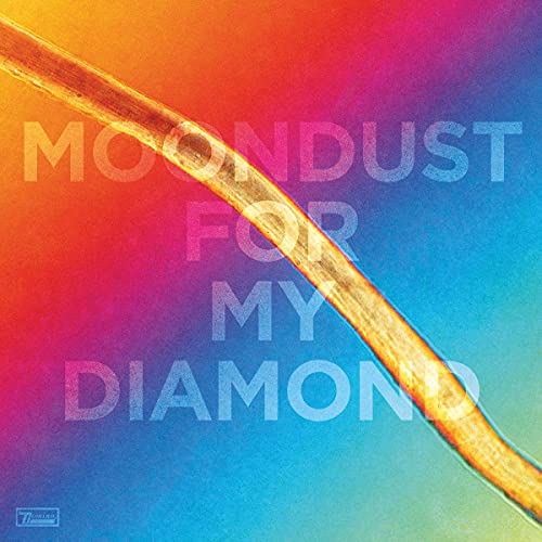 Album cover with text and a golden crescent shape on a colorful gradient.