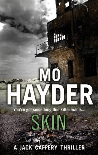 Book cover for Skin by Mo Hayder featuring a dilapidated building under a cloudy sky.
