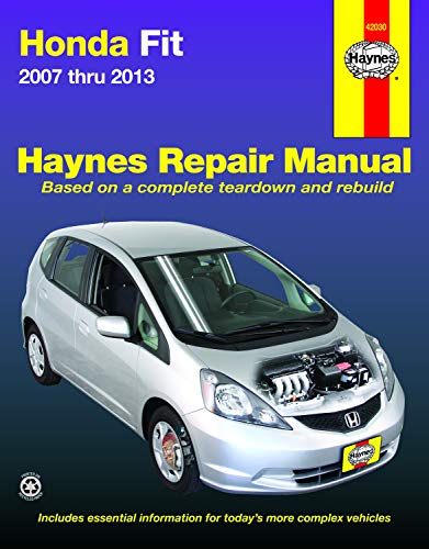 Silver Honda Fit car with engine cutaway, Haynes repair manual cover.