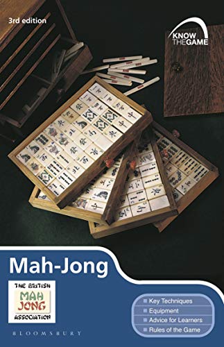 Book cover featuring wooden Mah-Jong tile trays and scoring sticks on a dark background.