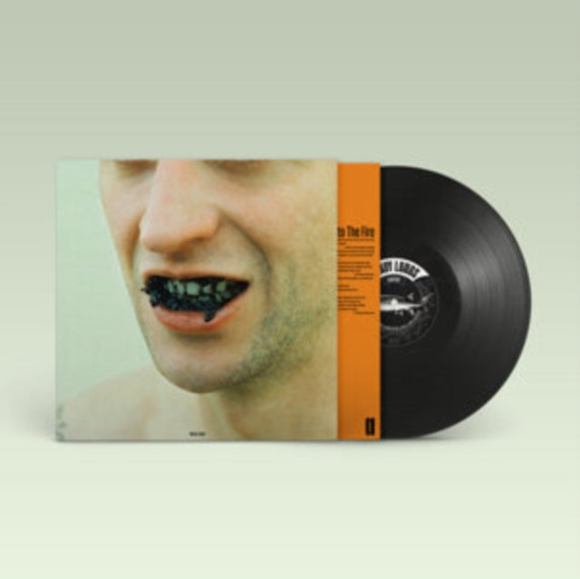 Album cover with a man’s face and black caviar in his mouth, vinyl record.