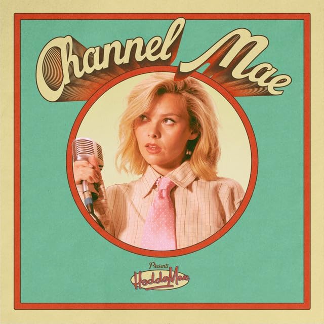 CD cover featuring a woman with blonde hair singing into a vintage microphone.