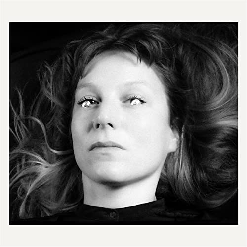 Black and white portrait of Hedvig Mollestad with flowing hair.